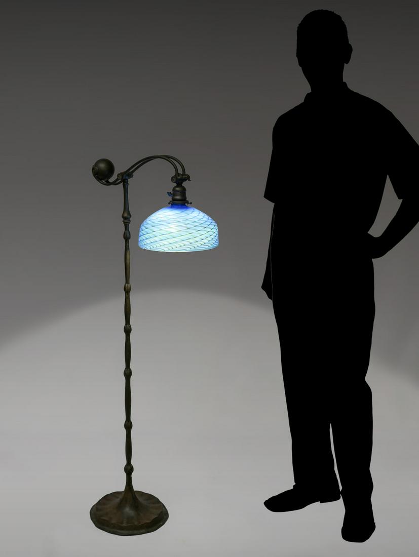 TIFFANY STUDIOS COUNTERBALANCE FLOOR LAMP W/ SHADE: TIFFANY STUDIOS COUNTERBALANCE FLOOR LAMP WITH SHADE: Bronze base with a circular ribbed base, floral motif decorated column, double ''S'' shaped arms at top with a large spherical counterbalance. Und