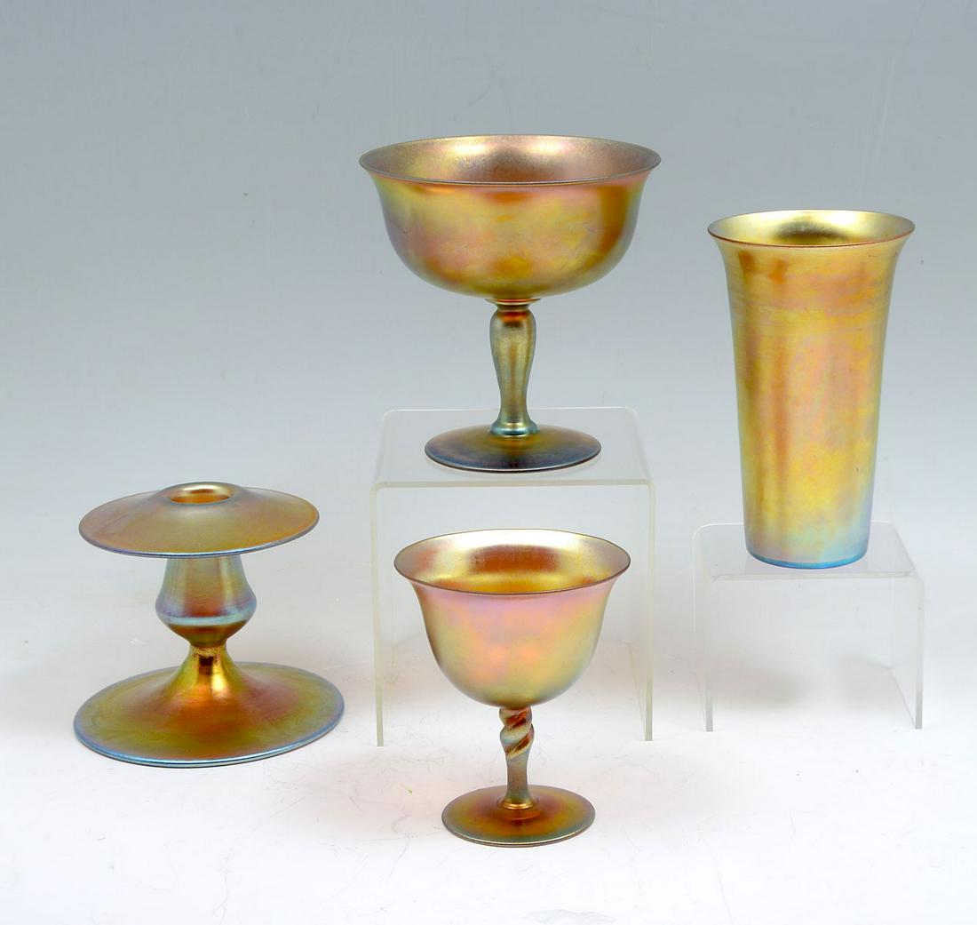 4 PC. STEUBEN GOLD AURENE GLASS COLLECTION: 4 PC. STEUBEN GOLD AURENE GLASS COLLECTION: Comprising; 1- Tall glass with flared rim, signed Aurene, #1969. 1- Large chalice, signed Aurene #2360. 1- Sherbert with a twisted stem, signed Steuben Aure