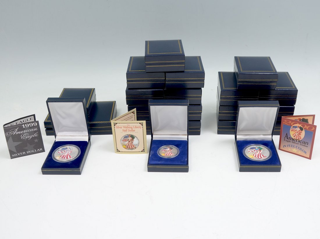 22 PAINTED SILVER AMERICAN COINS: 22 PAINTED SILVER AMERICAN COINS: Comprising; 10- 1943 Silver walking Liberty half dollars, 8- 2000 American Eagle Silver dollars, & 4- 1999 American Eagle silver dollars. All reside in plastic cases
