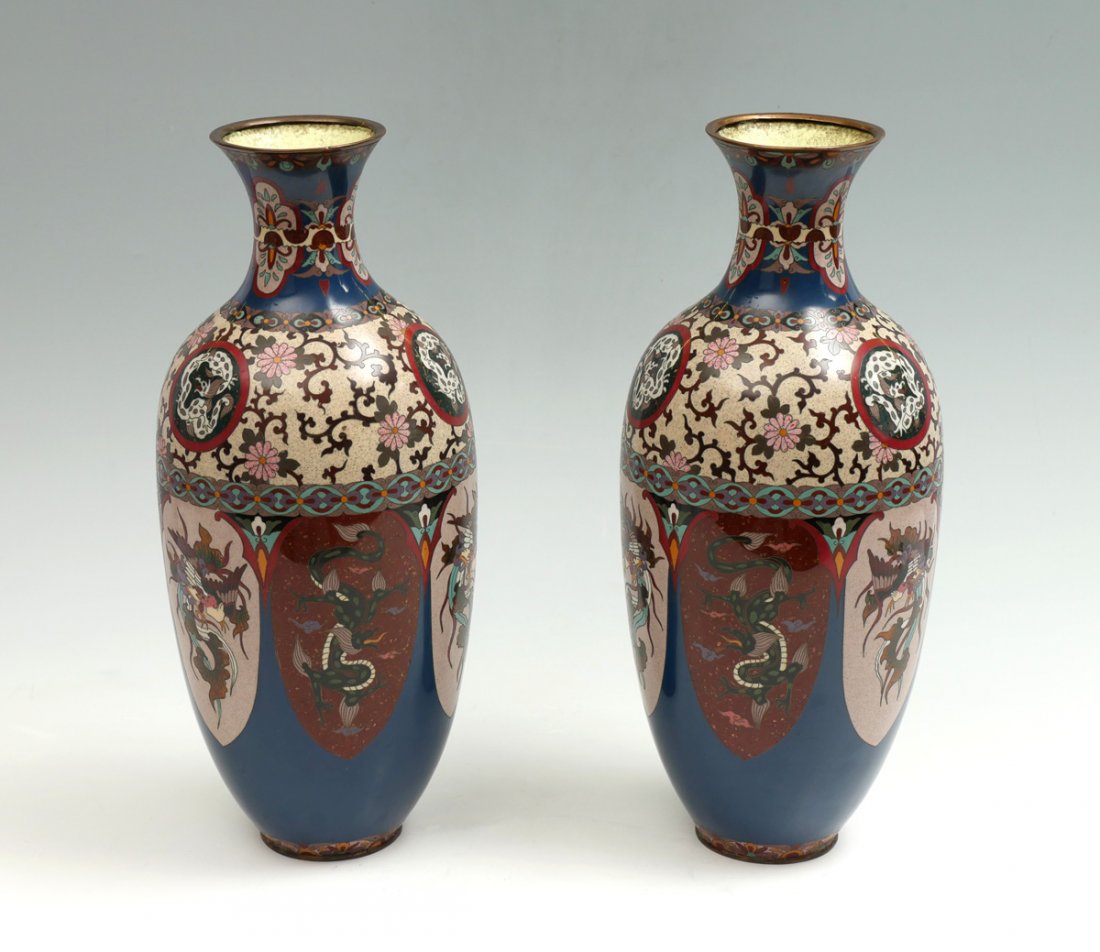 2 JAPANESE GINBARI CLOISONNE DRAGON & PHOENIX VASES: 2 JAPANESE GINBARI CLOISONNE DRAGON & PHOENIX VASES: 2 opposing Meiji period Japanese cloisonne vase, having Dragons & Phoenix with a scrolling foliate & floral medallion design. Approx. 18.25'' h x 7