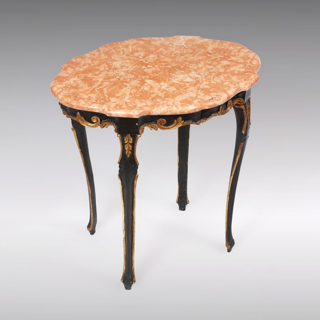 CONTINENTAL CARVED MARBLE TOP TABLE: CONTINENTAL CARVED MARBLE TOP TABLE: A fine marble top lamp table with shaped turtle top of molded marble similar to that of "Rojo Coralito Marble". Nicely Carved frame with scrolling acanthus leaf sp