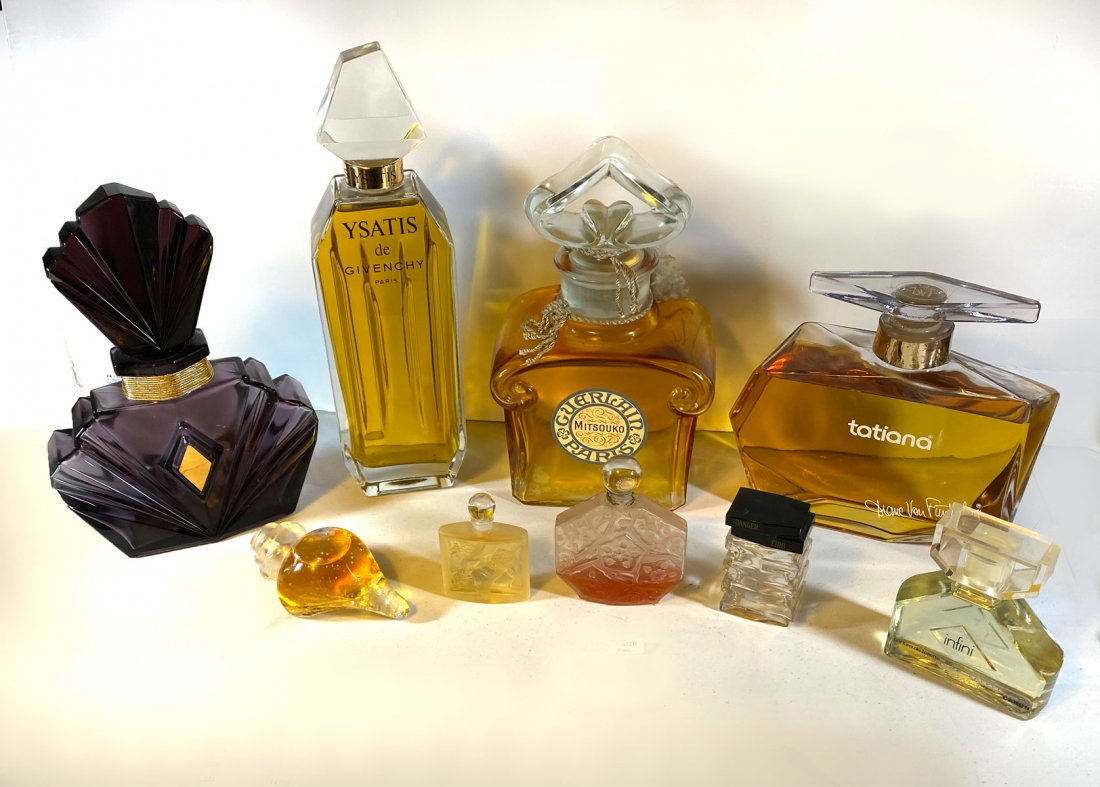 9 PIECE PERFUME BOTTLES: 9 PIECE PERFUME BOTTLES: 1) Elizabeth Liz Taylor Passion purple factice bottle, 12.5'' h; 2) Infini Caron factice?. Filled but no scents; 3) Full vintage Ombre Bleue by JC Brosseau 3.4 OZ Eau de Toile