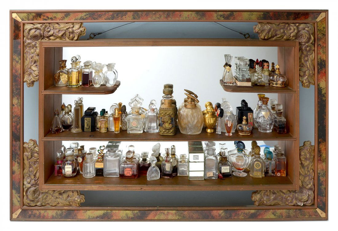 LARGE LOT OF VINTAGE PERFUME BOTTLES: LARGE LOT OF VINTAGE PERFUME BOTTLES: Sold with wall mount mirrored shadowbox. Most bottles are empty or near empty. Some of the fragrances include: Amour by Jean Patou, Salimar by Guerlain, Chanel, L
