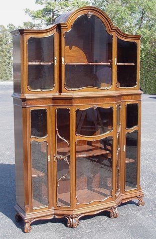 ENGLISH CHIPPENDALE BOOKCASE CURIO CABINET: ENGLISH MAHOGANY CHIPPENDALE BOOKCASE CURIO CABINET: Brass plate from Christopher Pratt & Sons Ltd. Bradford. Bonnet top, shaped glass panes framed in carved molding, scroll feet. 7'h. x 55" x 17".