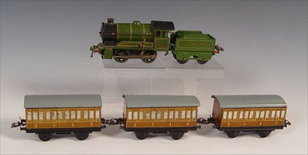 HORNBY MECCANO TRAIN SET TYPE 501: HORNBY MECCANO TRAIN SET TYPE 501: Clockwork engine #1842 (3 1/2" high x 7" long), 3 passenger cars (3 3/8" high x 7 3/4" long, note spotting and minor scratches from use), 1 coal car (2 3/4" high x 5