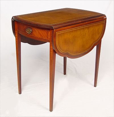 MAHOGANY LEATHER TOP PEMBROKE TABLE: MID 20TH CENTURY, HEPPLEWHITE STYLE, PEMBROKE TABLE: Swell front, with shaped drop leaves, embossed leather top. Satinwood banded inlays to frieze, string & bell pendant inlays to tapered legs. A fine