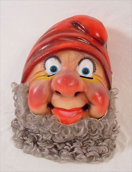 VINTAGE 1950'S DISNEY SEVEN DWARF'S MASK: VINTAGE 1950'S DISNEY SEVEN DWARF'S MASK: Molded plastic head mask with eye slits and holes for breathing. The mask has snaps on each side. It fits either child or adult. The head without beard measur