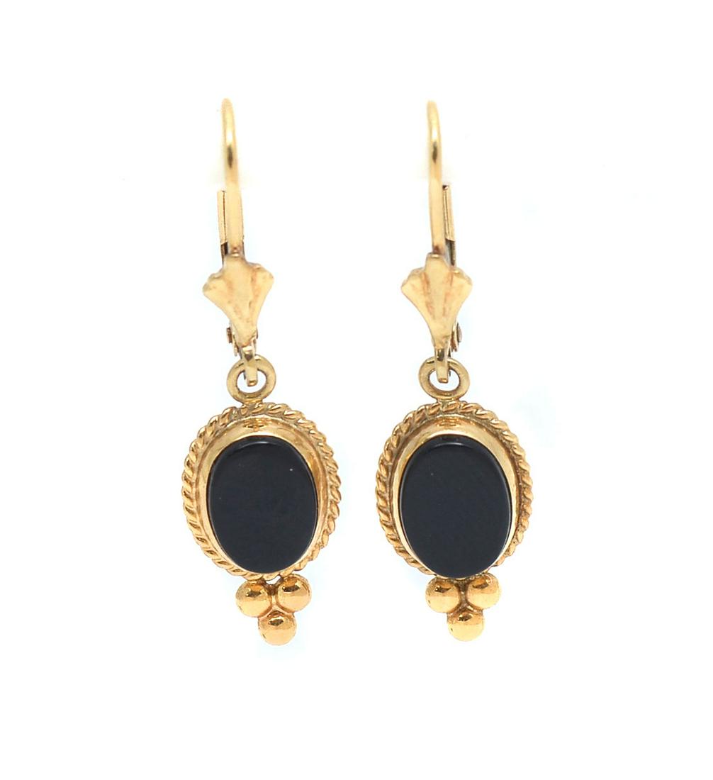 14K REVIVAL BLACK ONYX EAR WIRES: 14K REVIVAL BLACK ONYX EAR WIRES: Oval slices of 8.00 x 6.00 mm black onyx tablets set in 14K yellow gold by Carla in this Edwardian revival set of leverback earrings. Weight 2.0 grams.