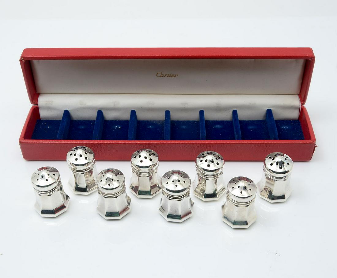CARTIER STERLING SALT & PEPPER SHAKERS: CARTIER STERLING SALT & PEPPER SHAKERS: 8 small sterling silver salt & pepper shakers by Cartier in original box. Each shaker 1 1/2" h. Box measures 1 1/2" x 9 1/2" x 2". Each shaker marked Cartier St