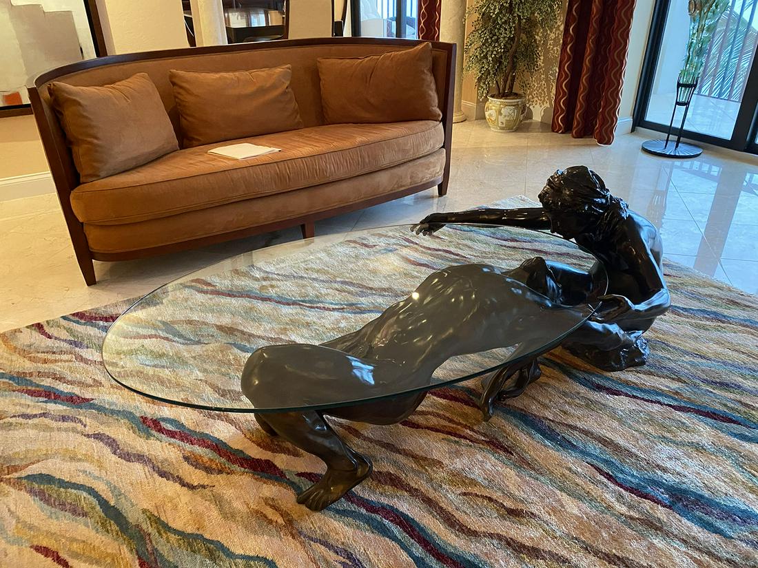 NEARLY LIFE SIZE BRONZE ADAM AND EVE COFFEE TABLE: NEARLY LIFE SIZE BRONZE ADAM AND EVE COFFEE TABLE: Illegibly signed W. Char? depicts an outstretched Adam leaning back into the nude body of Eve, height 30" and length is approx. 60". If you miss this