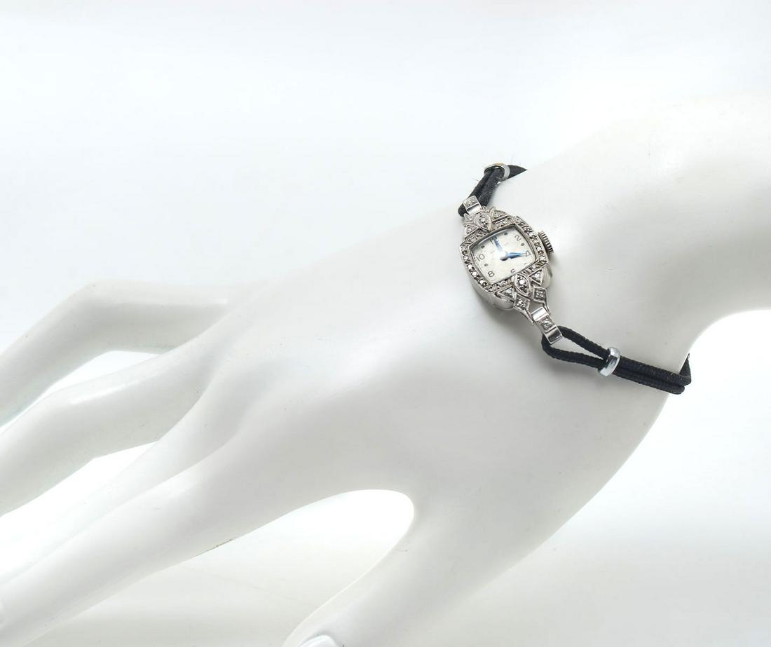 14K HAMILTON DIAMOND WRISTWATCH: 14K HAMILTON DIAMOND WRISTWATCH: 14K white gold Hamilton ladies wristwatch. Mechanical movement. The watch is running. DIAMOND WEIGHT: .25 Ct. Approx. Non gold bracelet. Length: 7" Gold Weight: 4.0 gr