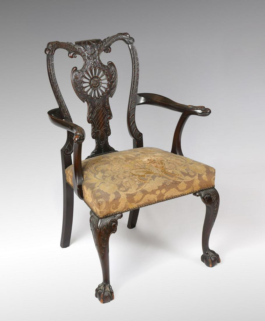 IMPRESSIVE CHIPPENDALE STYLE CARVED ARMCHAIR: IMPRESSIVE CHIPPENDALE STYLE CARVED ARMCHAIR: Carved Phoenix Bird Neck and Head on either side of crest rail, pierce carved back splat with sunflower motif, bird head arm rests, carved knees and ball 