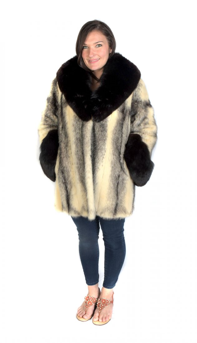 3/4 MINK & FOX FUR COAT: 3/4 MINK & FOX FUR COAT: Black & white mink coat has black fox trim at the standup collar and wide cuffs. Stylish embroidered black satin lining with monogram and M Solomon tag. 2 hook and eye closure