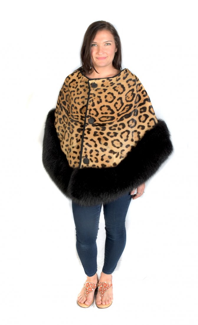 FUN LEOPARD PRINTED FUR WITH BLACK FOX TRIM CAPE: FUN LEOPARD PRINTED FUR WITH BLACK FOX TRIM CAPE: Fur cape with leopard print is trimmed with black fox and secured with 3 leather covered buttons. Small size.