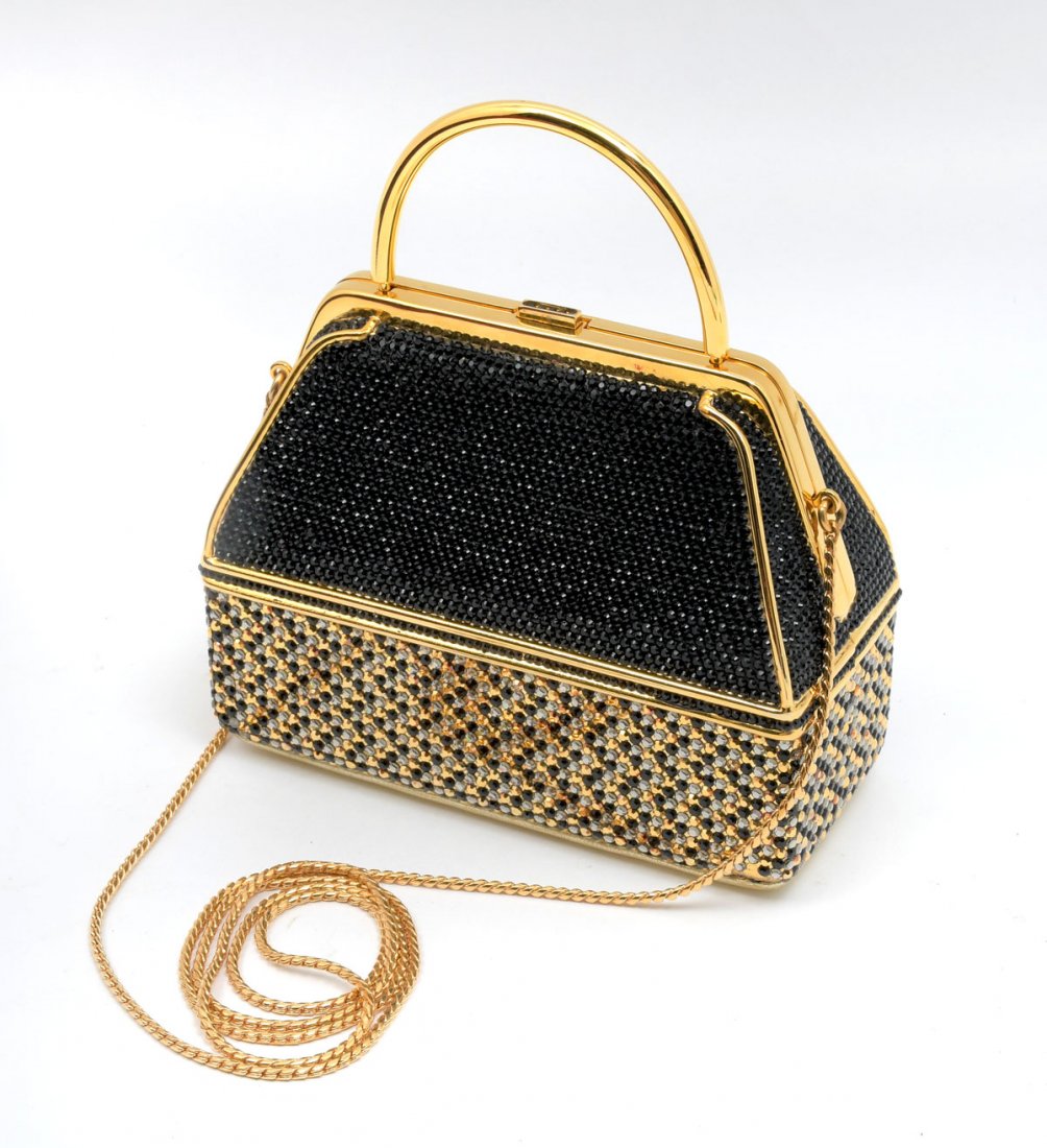 JUDITH LEIBER CROSS BODY BLACK AND GOLD CLUTCH: JUDITH LEIBER CROSS BODY BLACK AND GOLD CLUTCH: Gold frame and handle outlines the black Swarovski crystals on the top beautifully complimented by the black and gold crystals on the bottom. Gold chain