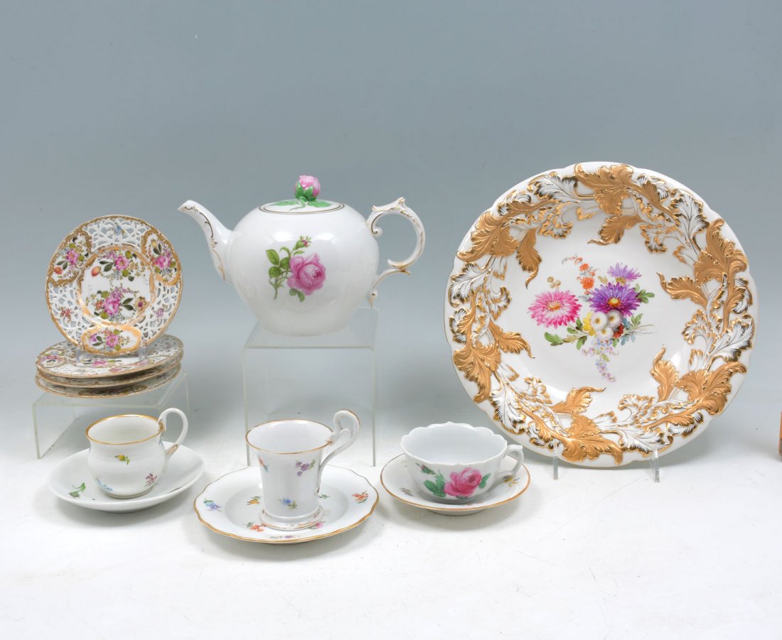 12 PC. FURSTENBERG AND MEISSEN PORCELAIN COLLECTION: 12 PC. FURSTENBERG AND MEISSEN PORCELAIN COLLECTION: Comprising; 3- Meissen cups, 3- Meissen saucers, 1- Furstenberg teapot, 4- Pierced Meissen saucers, having a painted floral design with gold foliat