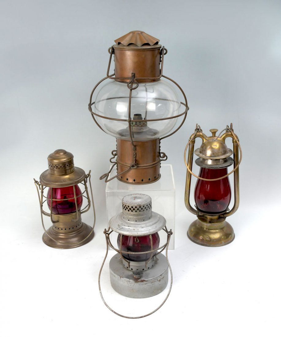 4 PC. GLASS SHIP LAMPS & LANTERNS: 4 PC. GLASS SHIP LAMPS & LANTERNS: Comprising; 1- Silver painted "Handlan" lantern with red glass shade. 1- Gold toned copper lantern with red glass globe. 1- Silvered copper lantern with red glass gl