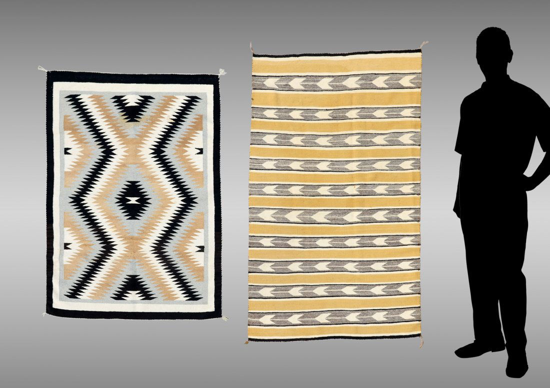 2 AMERICAN INDIAN WOVEN RUGS: 2 AMERICAN INDIAN WOVEN RUGS: 1) Two Grey Hills with arrow bands in white, grey, black and mustard/gold in repeating arrow bands. Measures approx 37.5" x 58"; 2) Ganado serrated diamond pattern in bla