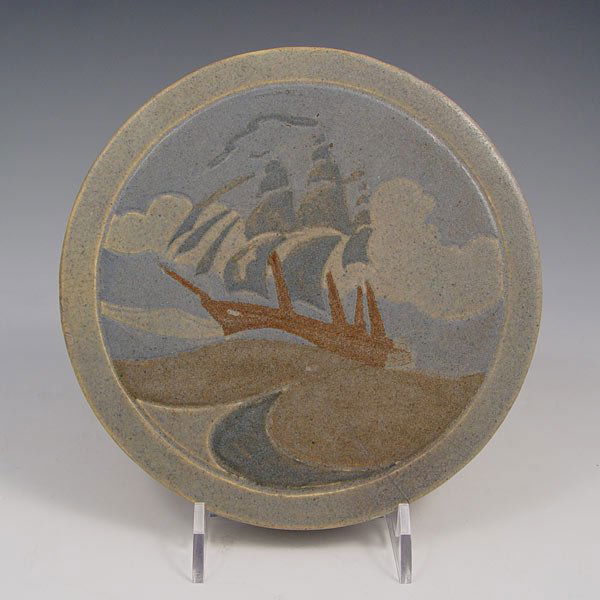 MARBLEHEAD POTTERY TILE / TRIVET: MARBLEHEAD POTTERY CIRCULAR TILE OR TRIVET: Carved and painted ships design, 6 3/8'' dia. 7/8'' thick. Impressed Ship mark. Sold with a later circular frame.