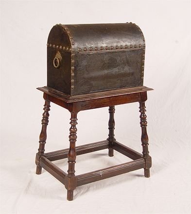 1920's DOME TOP HUMIDOR ON STAND: WILLIAM AND MARY STYLE 1920'S DOME TOP HUMIDOR ON STAND: Leather cover and tacks, copper lining. Humidor attached to stand with turned legs. Measures 34 1/2" h. x 22" x 13".