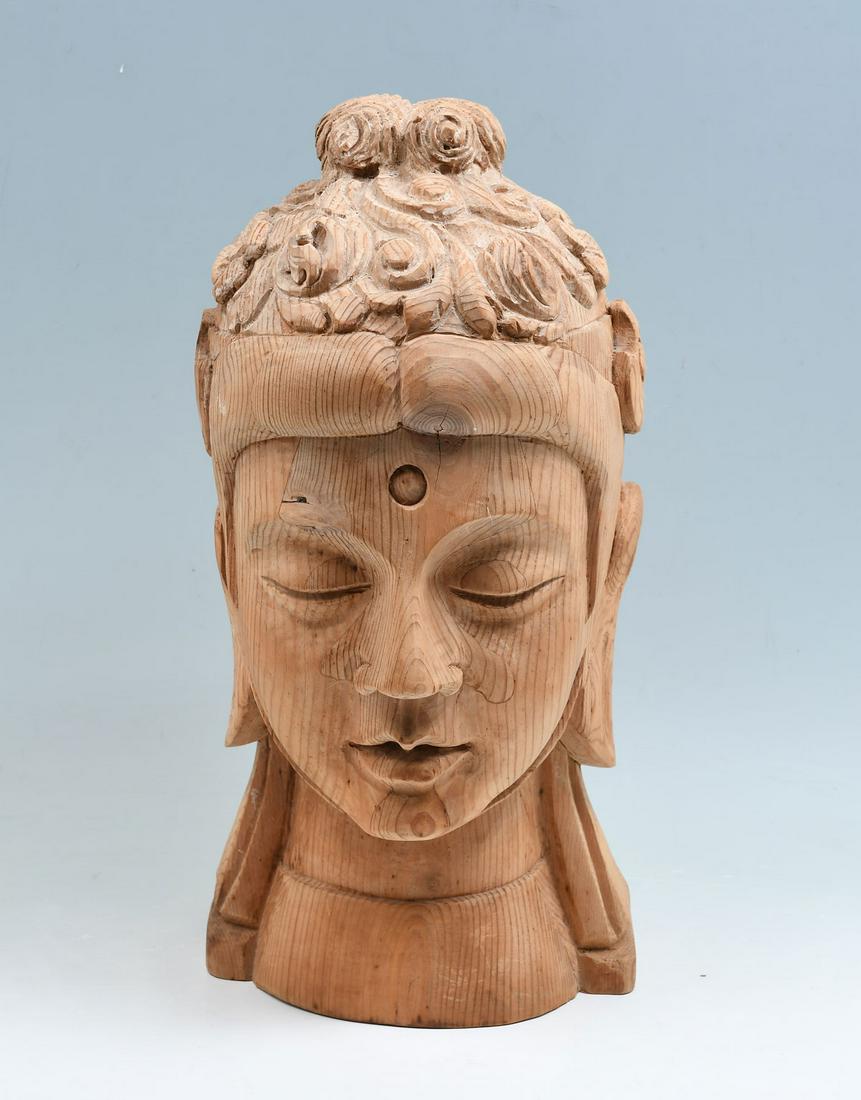 SPANISH CARVED BUDDHIST BUST: SPANISH CARVED BUDDHIST BUST: Large Spanish carved bust of an Asian deity. Approx. 17.5'' h x 8.25'' l x 8.75'' w.