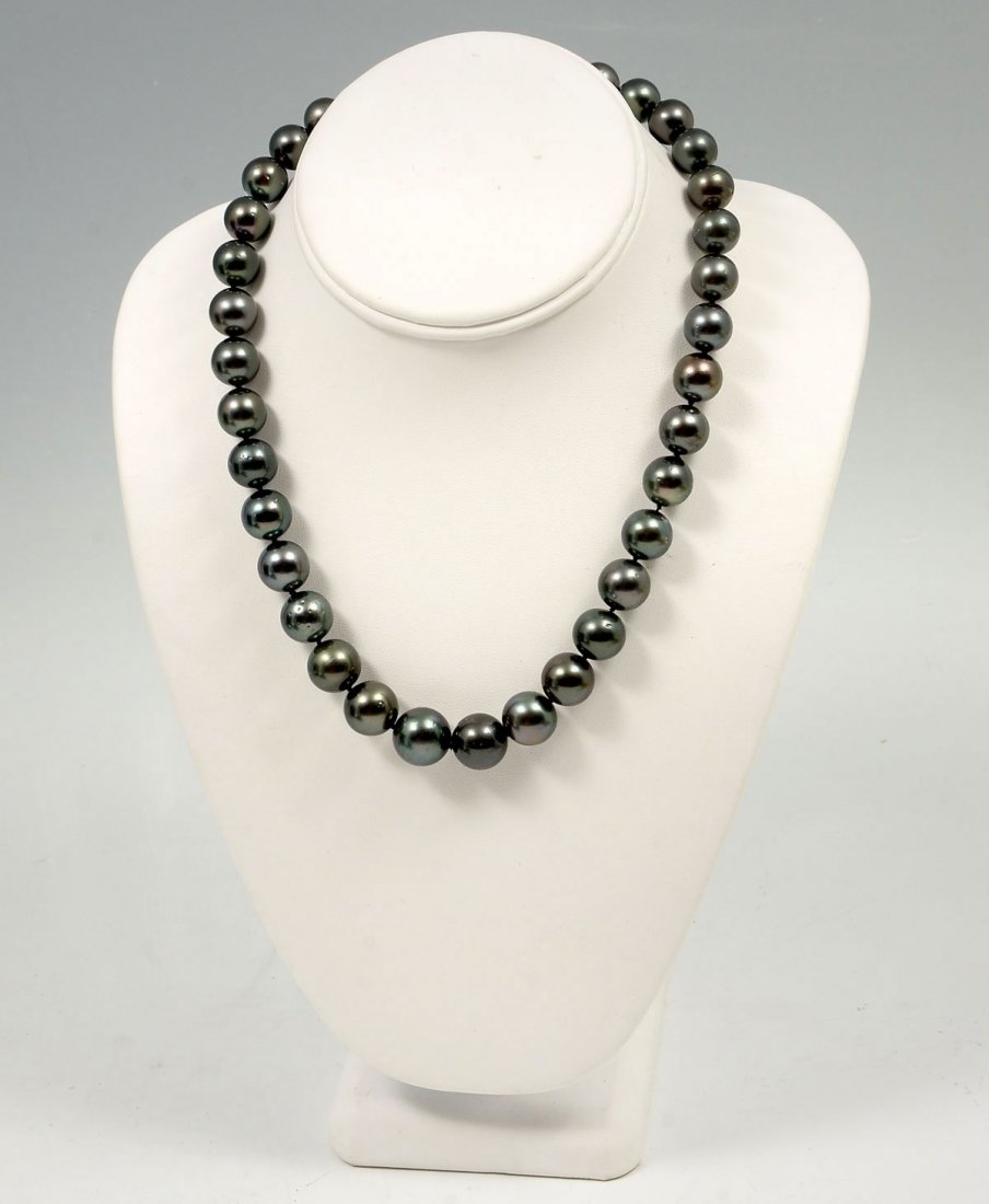 BLACK TAHITIAN PEARL NECKLACE: BLACK TAHITIAN PEARL NECKLACE: Single strand of graduated cultured Tahitian Pearls with each pearl individually hand knotted. 18" in length and finished with 14K white gold clasp. 35 pearls measure 11