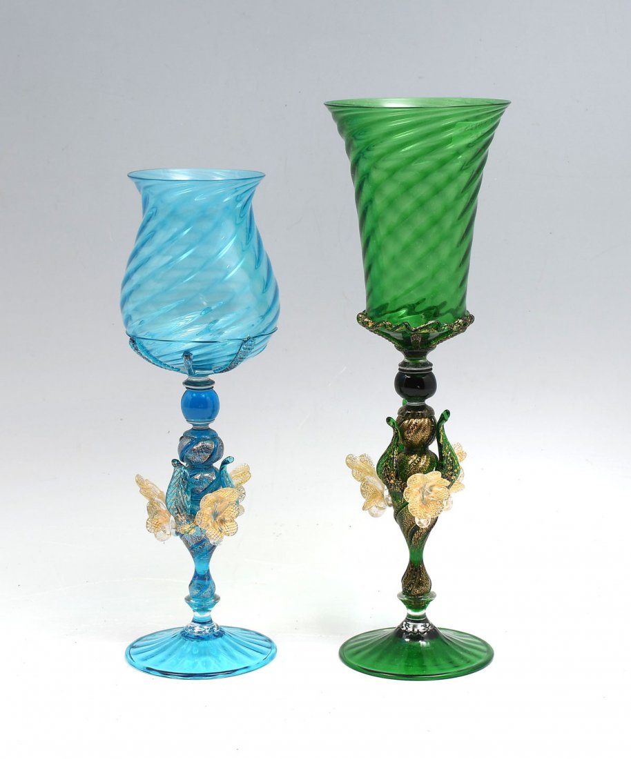 2 PIECE MURANO ART GLASS CHALICES: 2 PIECE MURANO ART GLASS CHALICES: 2- Blown art glass Murano chalices. Both having ribbed spiraling bodies with gold flaked stems, having an attached floral & foliate design. Original stickers reside 