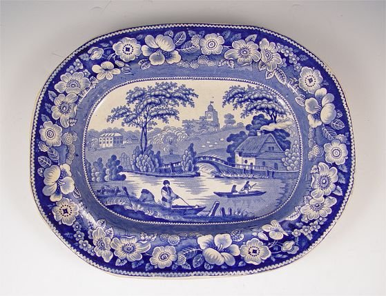 STAFFORDSHIRE WILD ROSE FLOW BLUE PLATTER: STAFFORDSHIRE ENGLISH FLO BLUE PLATTER: Podmore, Walker & Co., Tunstall, Ac. 1835-1859. Wild Rose platter, blue underglaze makers and pattern mark, impressed Stoneware. 13 1/4'' x 10 1/2''.