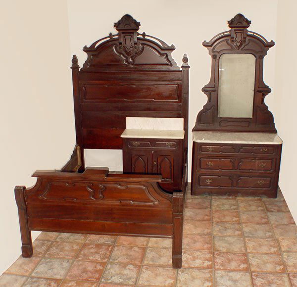 3 PC VICTORIAN BEDROOM SET late 19th C.: 3 PIECE VICTORIAN ROCOCO REVIVAL BEDROOM SET: Heavily carved crest with open fret on the bed and the dresser, raised panels throughout. Full size BED, headboard measures 85" h. x 58 1/2" x 3", foot bo