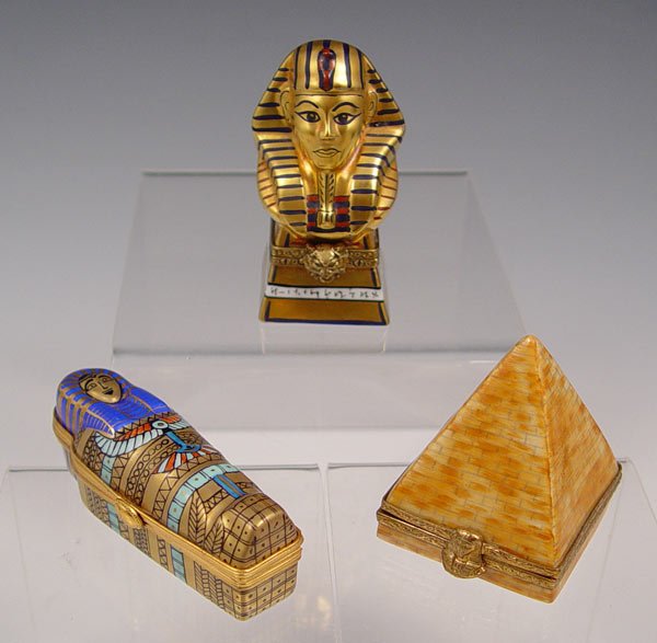 3 EGYPTIAN MOTIF LIMOGES PORCELAIN BOXES: 3 EGYPTIAN MOTIF LIMOGES PORCELAIN BOXES: All in their original boxes. 1) Renaissance Guild Pyramid, 131 of 750. 2) Renaissance Guild Mummy in Sarcophagus, 98/750. 3) Atelier de Limoges King Tut.