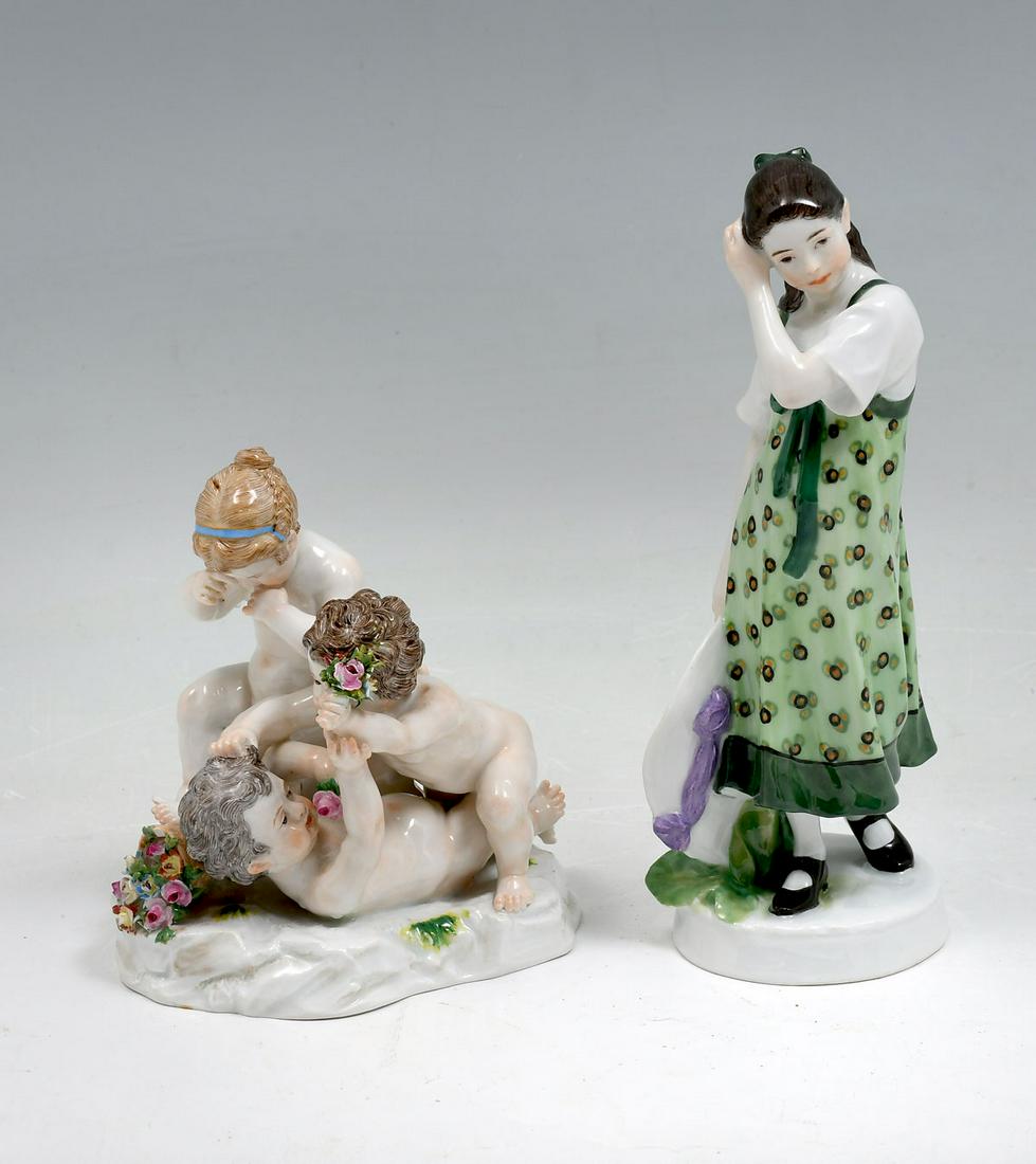 2 PIECE MEISSEN PORCELAIN FIGURES: 2 PIECE MEISSEN PORCELAIN FIGURES: Comprising; 1- Young girl in dress with hat in hand. 1- Playful cherub grouping who seem to be fighting over flowers. Both have crossed blue sword mark at undersides