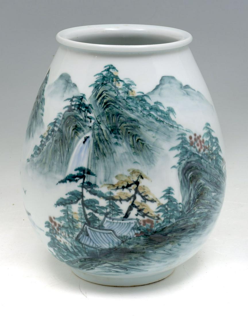 JAPANESE SCENIC PORCELAIN VASE: JAPANESE SCENIC PORCELAIN VASE: Japanese porcelain vase, having a mountainous scene with raised features. Stamp at underside. Approx. 10.25'' h x 8.5'' w.