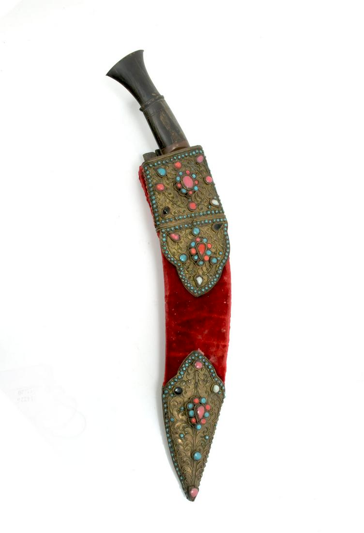 MIDDLE EASTERN KNIFE AND SHEATH: MIDDLE EASTERN KNIFE AND SHEATH: Having an incised curved blade mounted to an ebonized wood handle. Residing in a copper & red velvet with gilt metal work, adorned by inset Coral, Turquoise, & natural