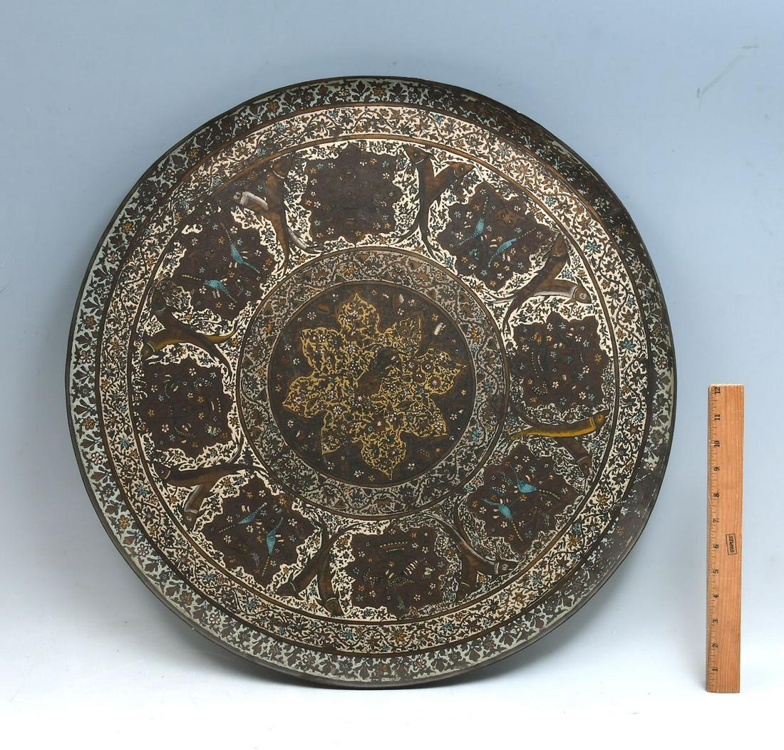 ENAMELED METAL MIDDLE EASTERN CHARGER: ENAMELED METAL MIDDLE EASTERN CHARGER: Elaborately enameled large metal charger, having an overall floral & scrolling foliate motif with alternating Birds & Fish. Approx. 23" Dia, from the Maestro Din