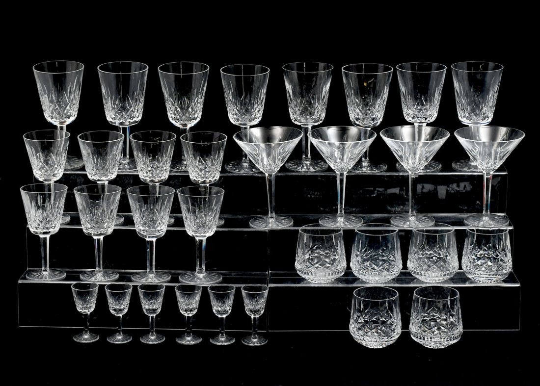 32 PIECE WATERFORD LISMORE CRYSTAL STEMWARE: 32 PIECE WATERFORD LISMORE CRYSTAL STEMWARE: Comprising; 6- Highball glasses, 4- Martini glasses, 8- Red wine glasses, 8- White wine glasses, & 6- Cordials.