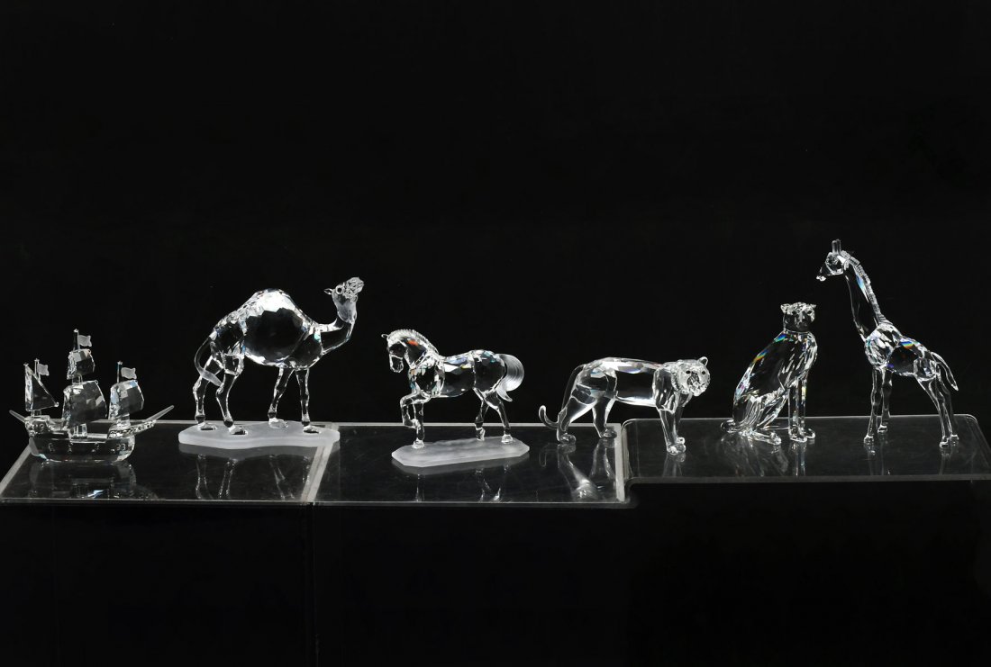 6 SWAROVSKI SILVER CRYSTAL PIECES: 6 SWAROVSKI SILVER CRYSTAL PIECES: 1) Santa Maria sailing ship #7473; 2) Cheetah figurine is part of the African Wildlife services and is #183225; 3) Crystal Giraffe; 4) Camel figure #7603; 5) Arabian