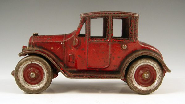 CAST IRON KENTON TOY COUPE: CAST IRON KENTON TOY COUPE: Original red paint. Nickeled wheels. Measures 3 1/4'' high x 6 1/4'' x 2 1/2''