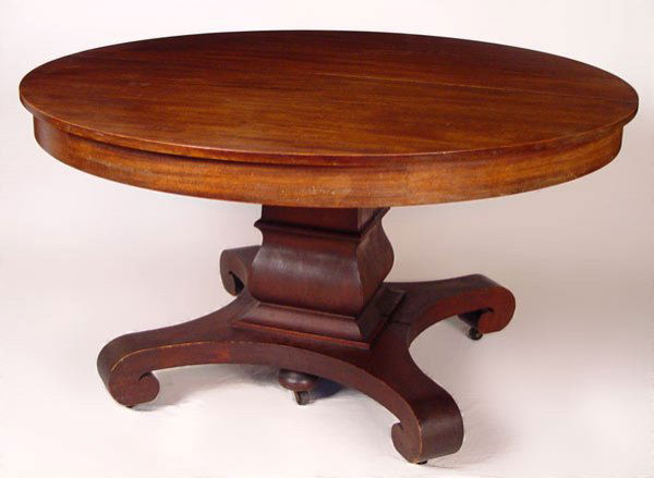MAHOGANY BERKEY & GAY PEDESTAL DINING TABLE: BERKEY & GAY ROUND PEDESTAL DINING TABLE: Expandable mahogany table with three leaves, scrolled foot design with central leg support when open. Worn finish. Measures 29 1/2" high x 54 1/4" dia. closed