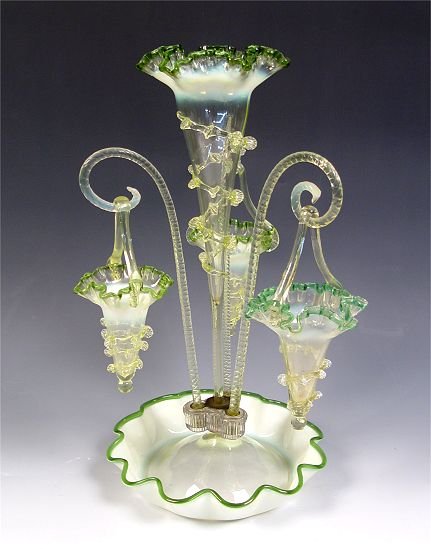VICTORIAN GREEN OPALESCENT ART GLASS EPERGNE: VICTORIAN GREEN OPALESCENT ART GLASS EPERGNE: Central vase with three hanging baskets, high fluorescence under a black light. 18" tall, the base is 10" dia.