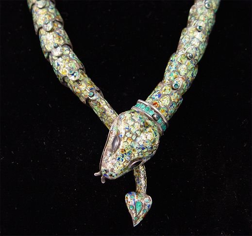 MARGOT de TAXCO ENAMELED STERLING SNAKE NECKLACE: MARGO DE TAXCO ARTICULATED MEXICAN STERLING SNAKE COLLAR NECKLACE: Articulated snake grasping his own tail. Enameled ''scales'' and head highlighted with green paste stones. Clasp is at the back with