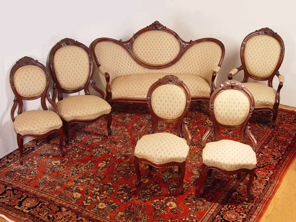 6 PIECE VICTORIAN WALNUT PARLOR SET: 6 PIECE VICTORIAN WALNUT PARLOR SET: Good quality with gratefully carved curved frame and simple woven upholstery. Medallion back SETTEE, 66" long x 31" deep x 41" tall. GENTS high back parlor chair, 