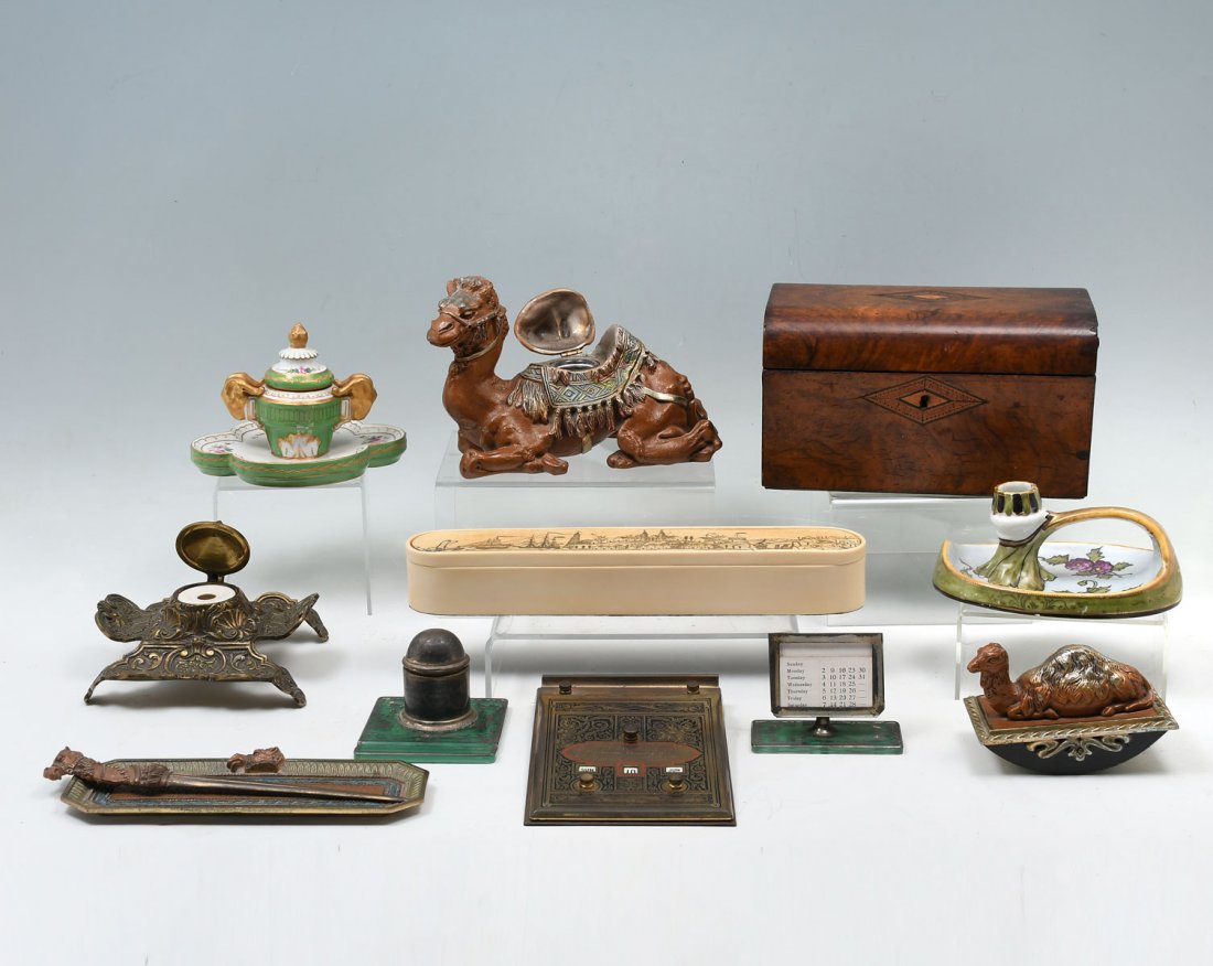 12 PC. INKWELL & DESK SET COLLECTION: 12 PC. INKWELL & DESK SET COLLECTION: Comprising; 4 pc. Camel motif desk set, 2 pc. inkwell & calendar with silver overlay, 1- brass art nouveau inkwell, 1- Resin faux scrimshaw box, 1- porcelain cand