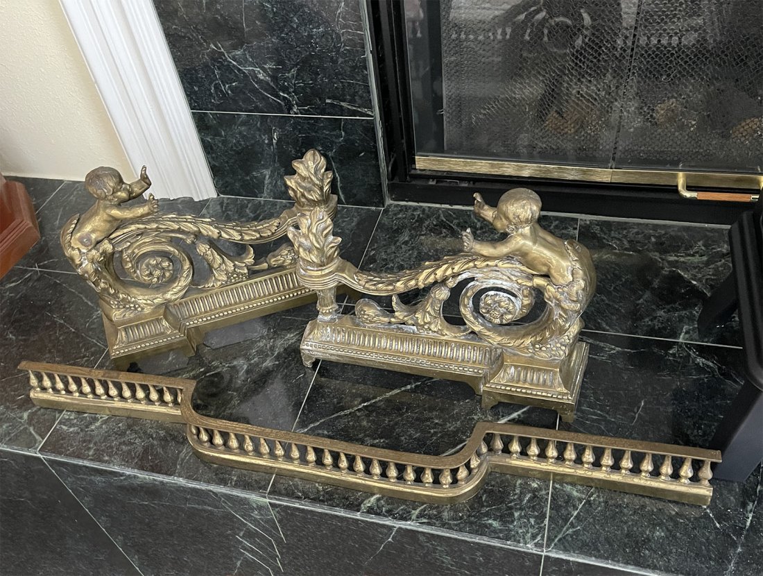 3 PC. FRENCH CHERUB FIRE CHENETS: 3 PC. FRENCH CHERUB FIRE CHENETS: Comprising; 2- Brass andirons, having a cherub reaching over the scrolling foliate to warm hands. Central bar has an overall baluster column design. Approx. 10.75'' h