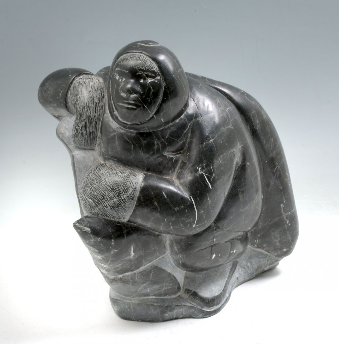 CARVED ESKIMO HUNTER INUIT SOAPSTONE SCULPTURE: CARVED ESKIMO HUNTER INUIT SOAPSTONE SCULPTURE: Approx. 12" in height, no visible signature, several visible stress cracks.