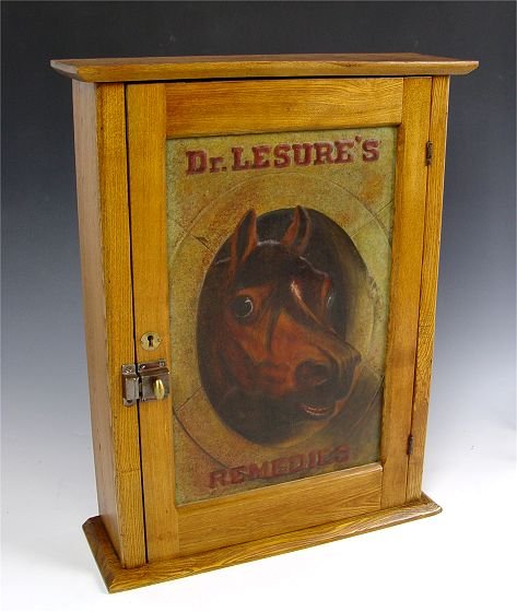 DR. LESURE'S VETERINARY MEDICINE CABINET: DR. LESURE'S VETERINARY MEDICINE CABINET: Embossed tin front, chestnut case. Original paint. 3 interior shelves. 27" h. x 20 3/4" x 6 3/4"