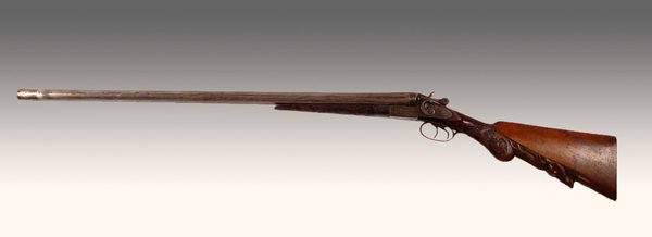 1890 CARVED ELK STOCK WILMOT DOUBLE BARREL SHOTGUN: 1890'S WILMOT BELGIAN OVERHAMMER DOUBLE BARREL SHOTGUN: Nicely carved elk with oak leaves stock. Manufactured by Henri Pieper, Belgium, imported for Wilmot Gun Co. Engraved hunt dog scene on hammer pl