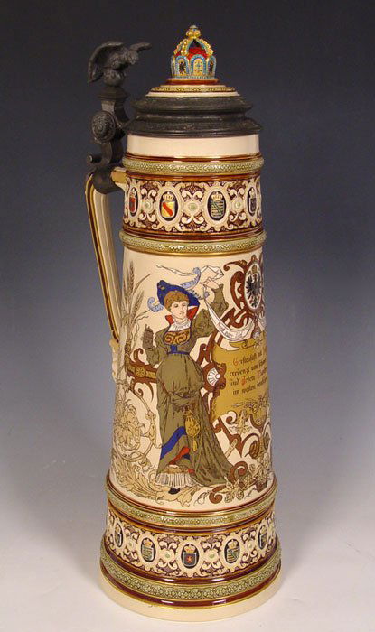 VILLEROY & BOCH 7 LITER METTLACH STEIN #1161: VILLEROY & BOCH 7 LITER METTLACH STEIN #1161: Etched design body with maidens and heraldic shield with motto. Crown lid with eagle thumbpress. Measures 22 1/4'' h. x 7 3/4'' base dia.