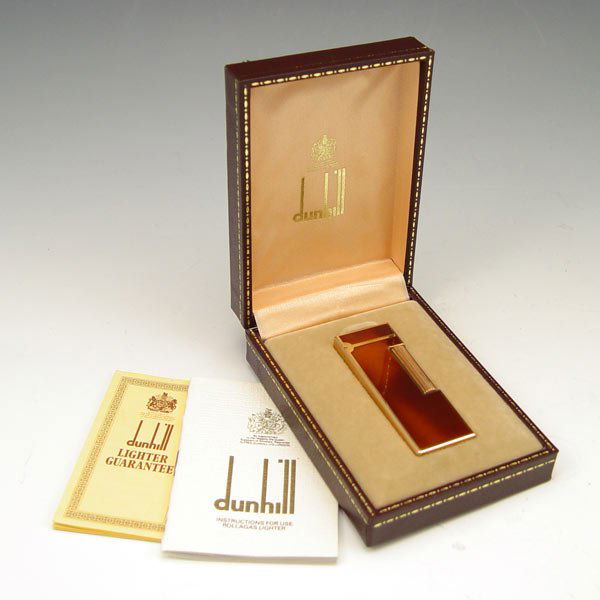 DUNHILL TORTOISE SHELL ROLLAGAS LIGHTER: DUNHILL TORTOISE SHELL ROLLAGAS LIGHTER: Tortoise shell lacquer case. Sold with original box and paperwork.