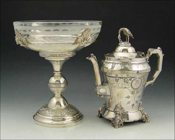 2 PC VICTORIAN SILVERPLATE Stork Finial Pot: STORK FINIAL SILVERPLATE COFFEE POT AND CENTERBOWL: Includes 1) F. O. Webster & Bro. coffee pot with unique stork and egg finial, engraved design, and figural face feet. 9 3/4" h. x 9 1/2". 2) Silverp