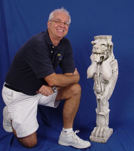 ARCHITECTURAL BRUSHED MARBLE ZOOMORPHIC PEDESTAL: ARCHITECTURAL BRUSHED MARBLE & CONCRETE ZOOMORPHIC PEDESTAL: Dog head with rolled out tongue, exaggerated human breast with wings and claw feet, hawk hanging from neck. Approx. 37 1/2" h. x 8" x 13"